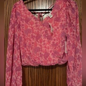 Pink blouse with flower designs